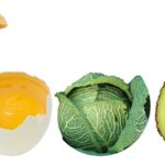 Cibi sani per ridurre il colesterolo, come frutta, verdura e legumi, disposti su un tavolo.